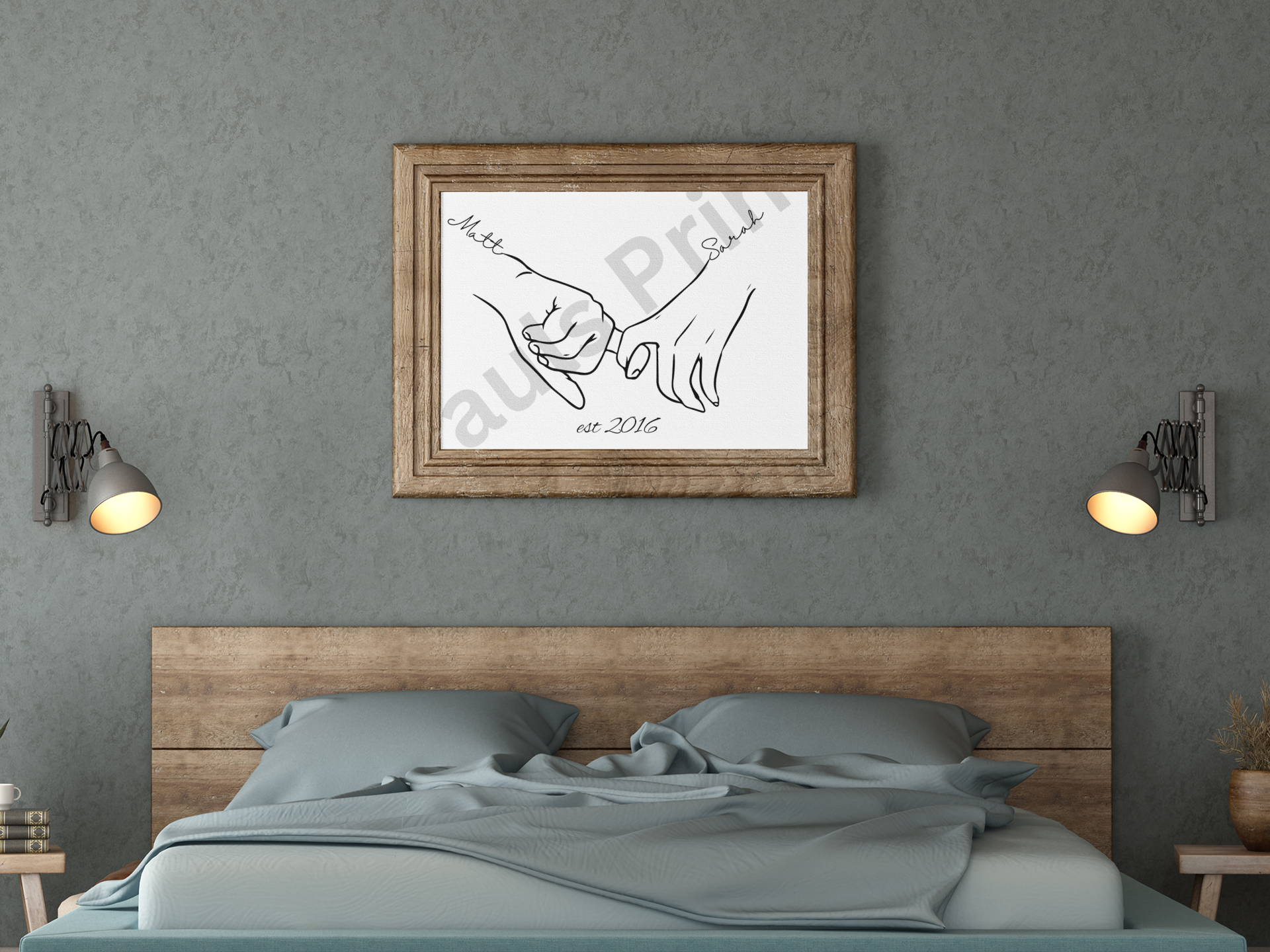 Line art of couple holding hands with personalised names Matt and Sarah and est. 2016, in a rustic wood frame above a bed with blue sheets