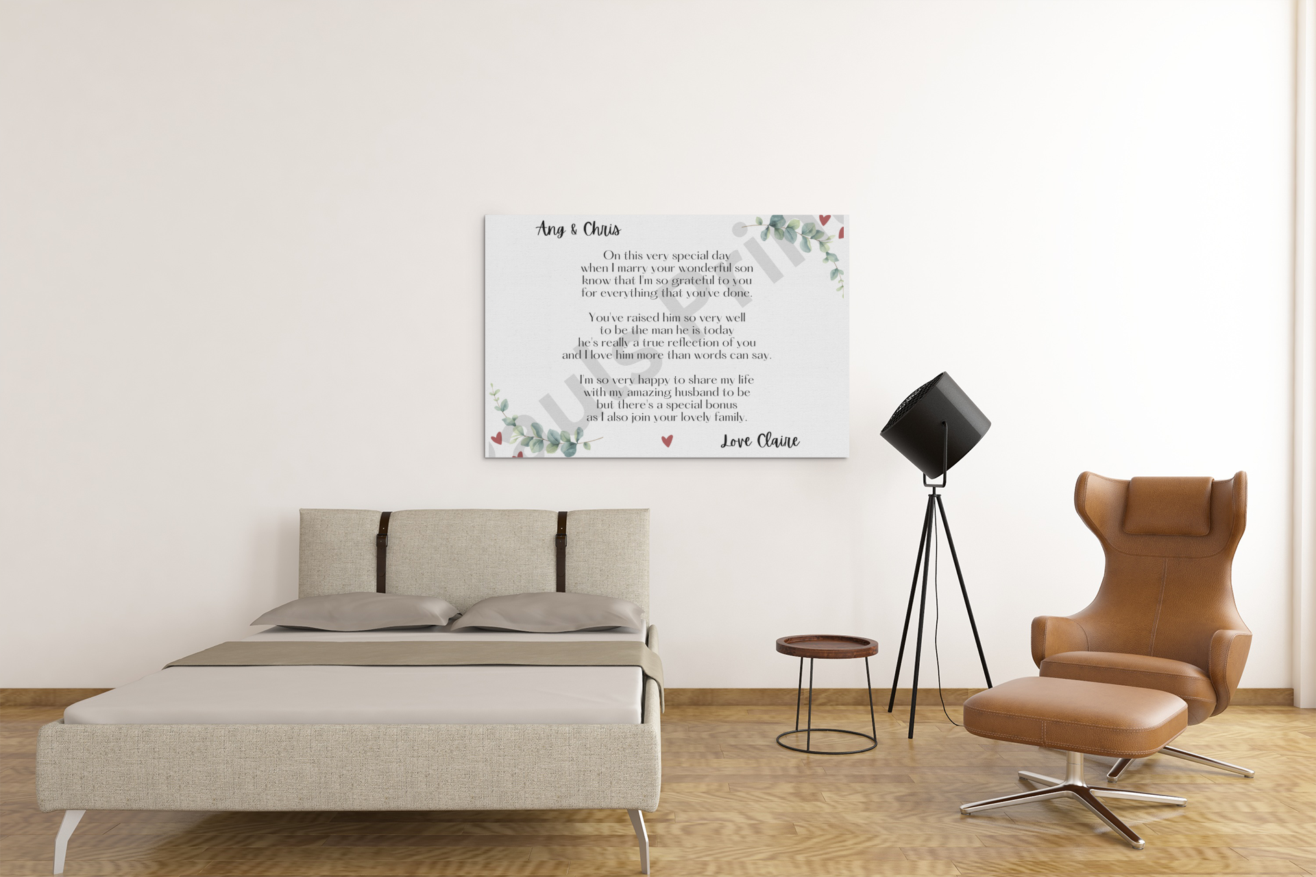 Wedding day message canvas print hanging above a beige bed, next to a modern brown armchair and black floor lamp
