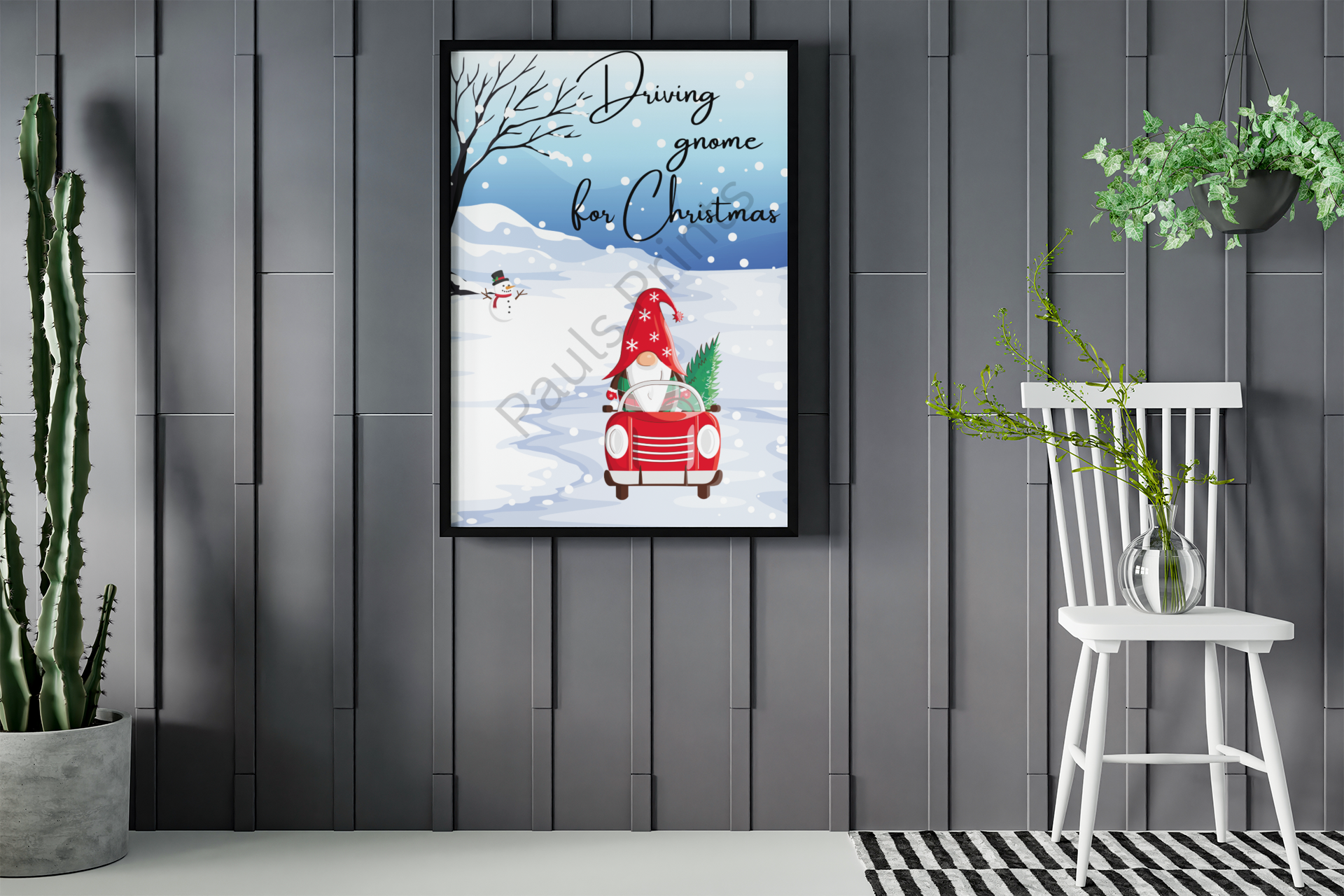 Gnome in red car with Christmas tree artwork in black frame, displayed in modern grey interior with plants.