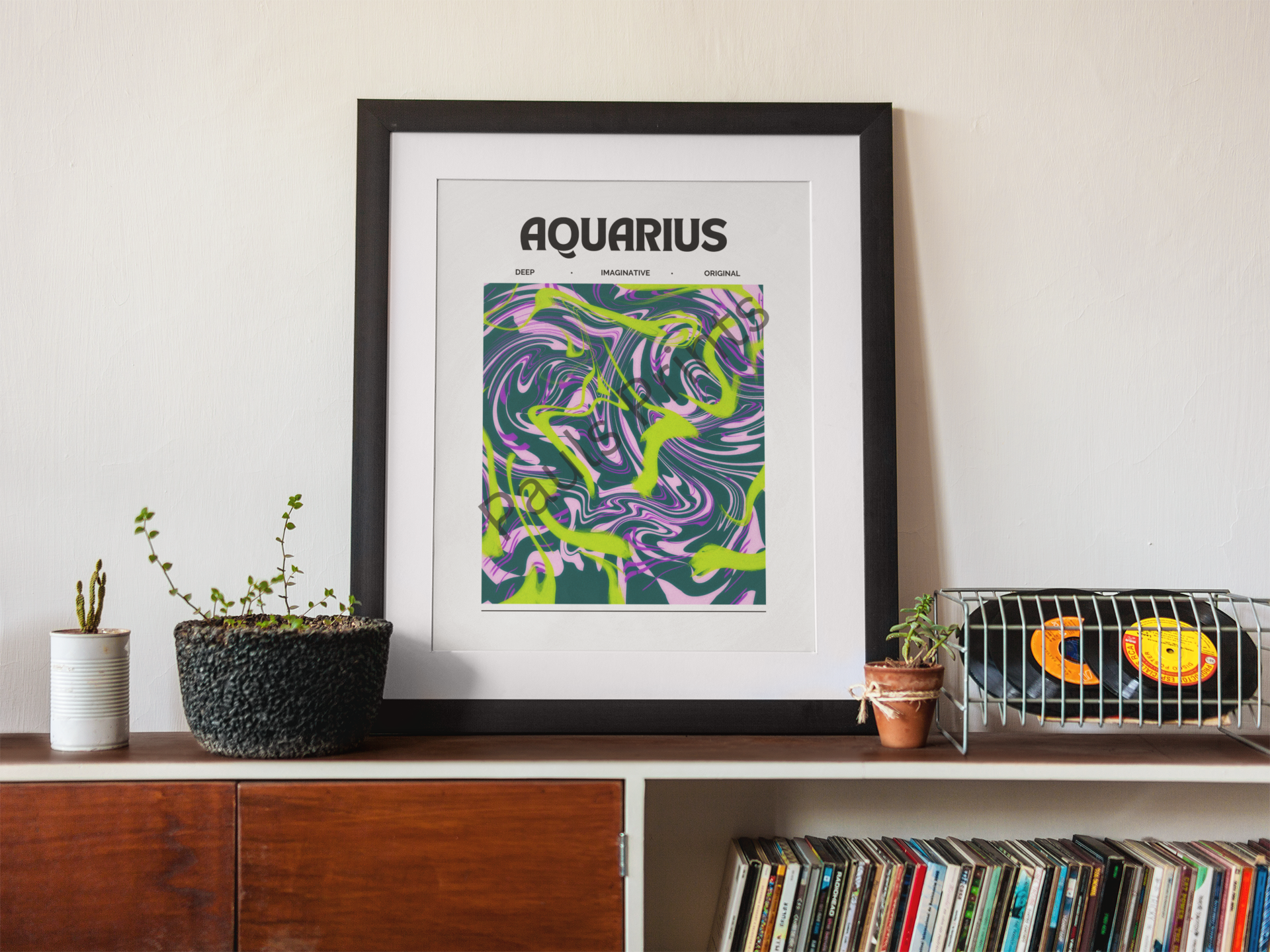 Aquarius zodiac sign poster in a wooden frame, styled with a ceramic mug, dried floral stems, and cosy textured elements on a minimalist bench.