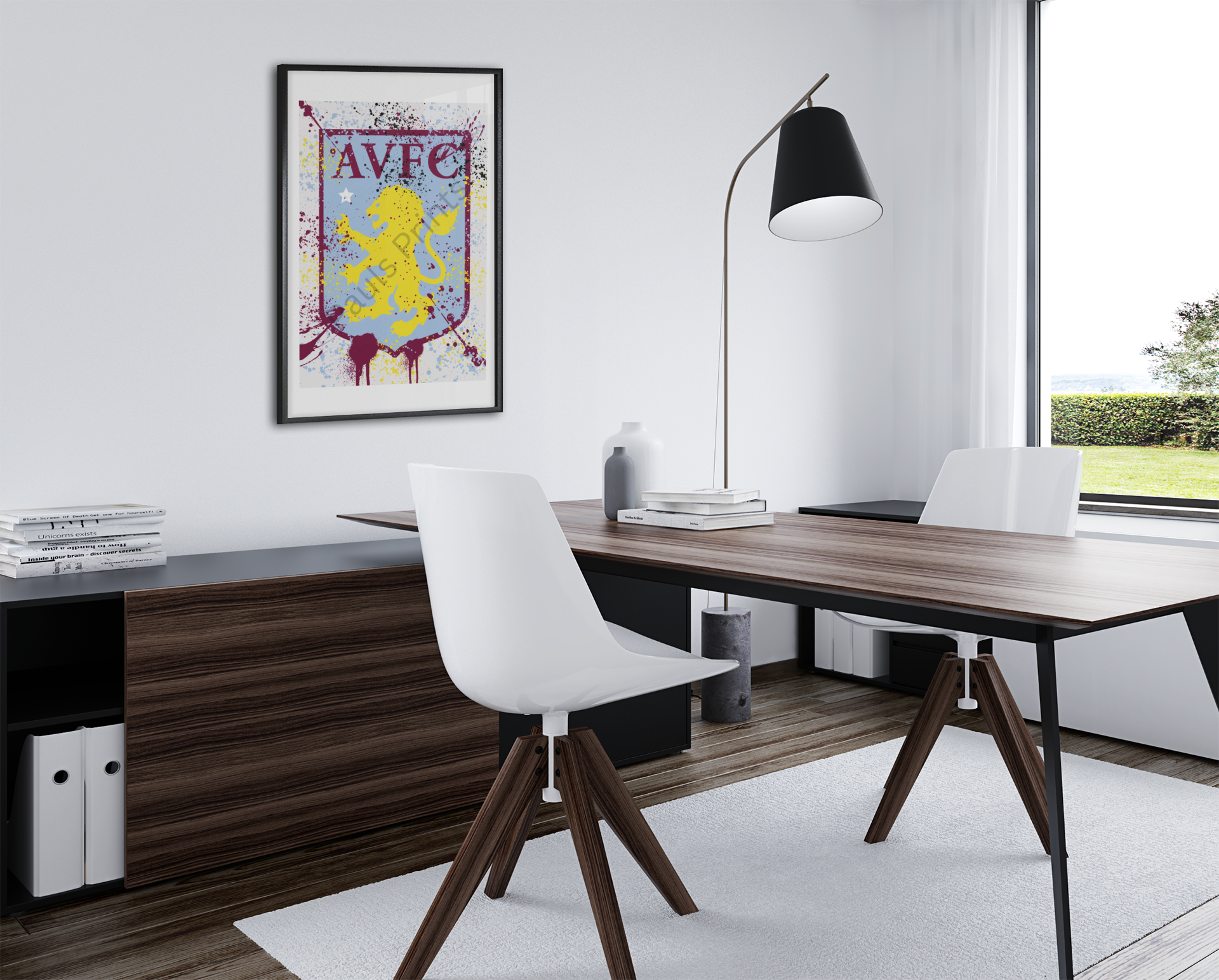 Stylish Aston Villa FC crest print with splatter paint effect in black frame, displayed on a modern office wall above a desk.