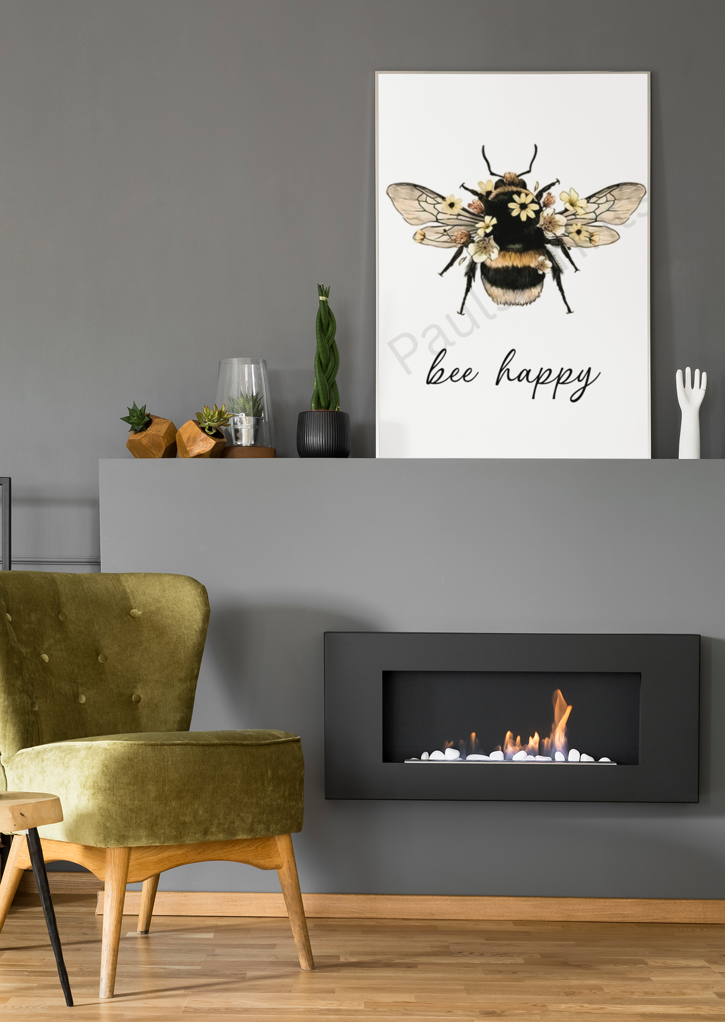 Large “bee happy” wall art with detailed bee and floral design, leaning on a grey fireplace mantel next to modern decor items.