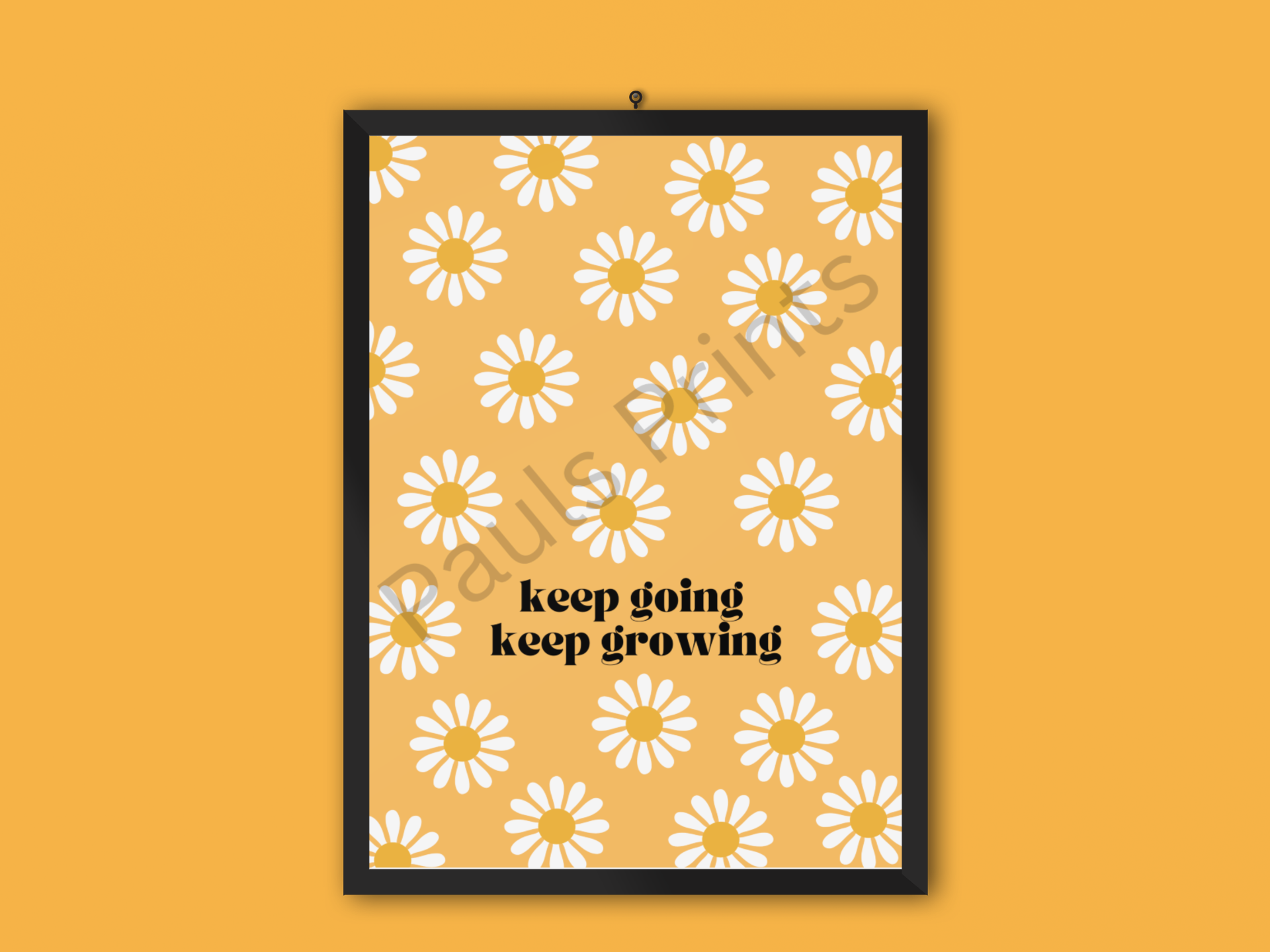 Bold yellow daisy print with white petals and the words "keep going keep growing", set in a black frame against a matching yellow background.
