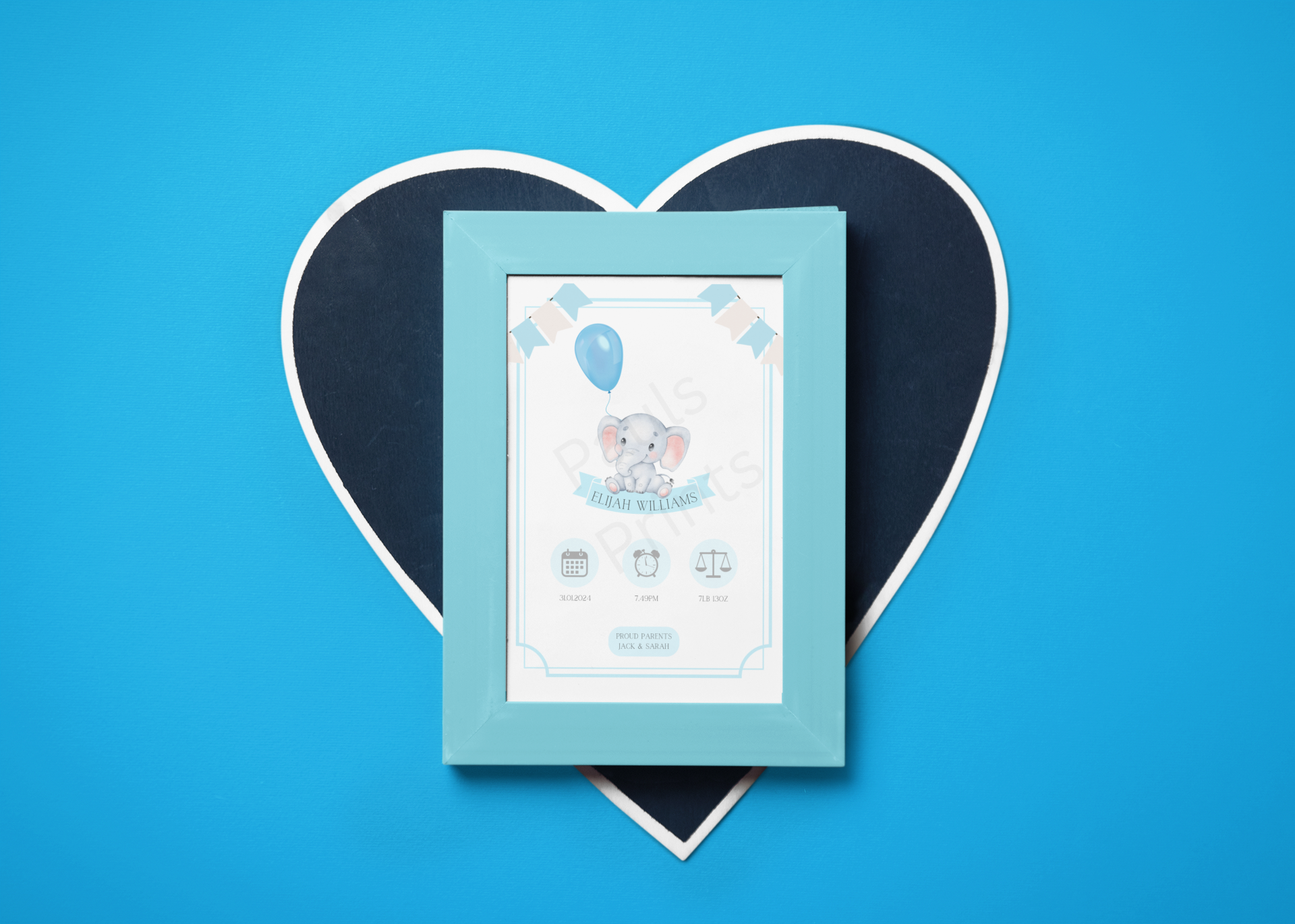 Custom elephant baby print in a blue frame, placed on a heart-shaped background against a vibrant blue backdrop.