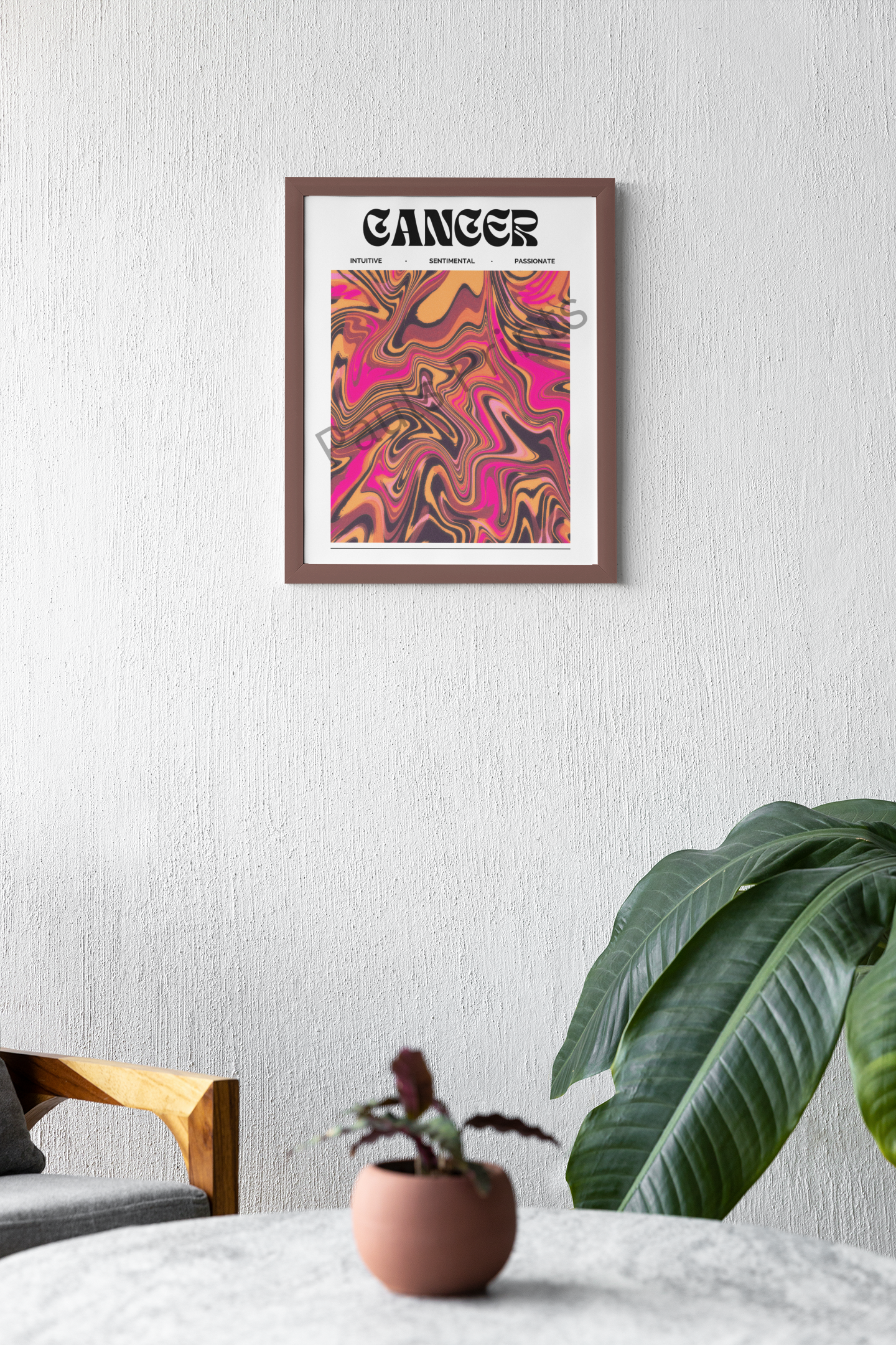 Warm and modern interior featuring a framed Cancer zodiac poster with pink and orange swirls, styled above a wooden chair and leafy plants.