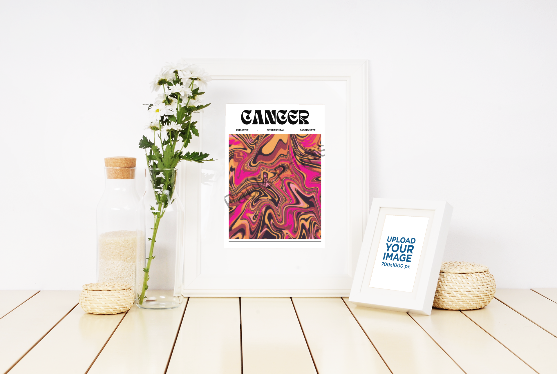 Cancer star sign print in a white frame, featuring vibrant abstract art, displayed beside glass bottles, wicker decor, and a white flower stem.