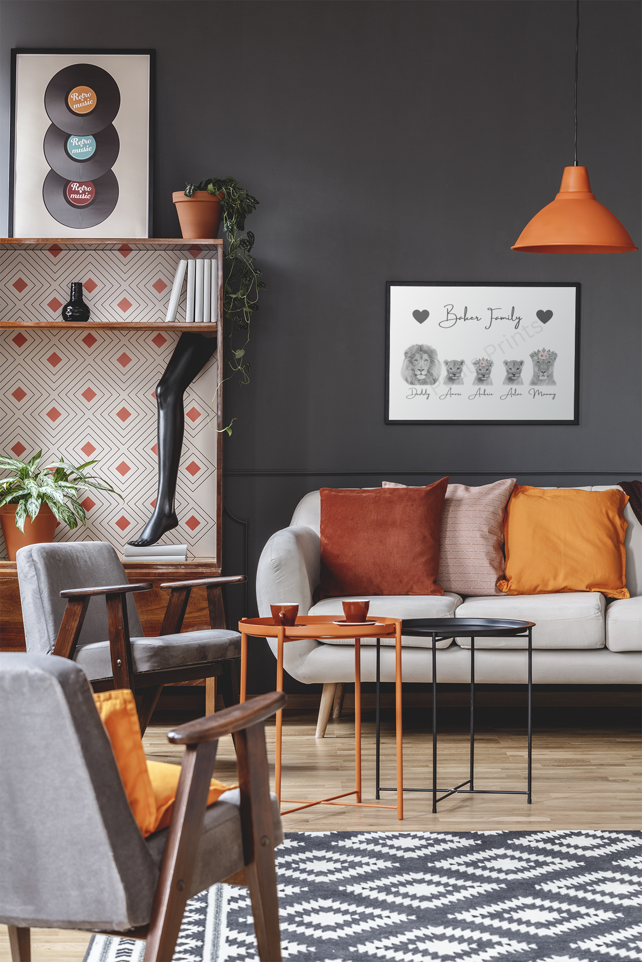 Personalised lion family print with heart details displayed in a black frame in a modern living room with orange accents.