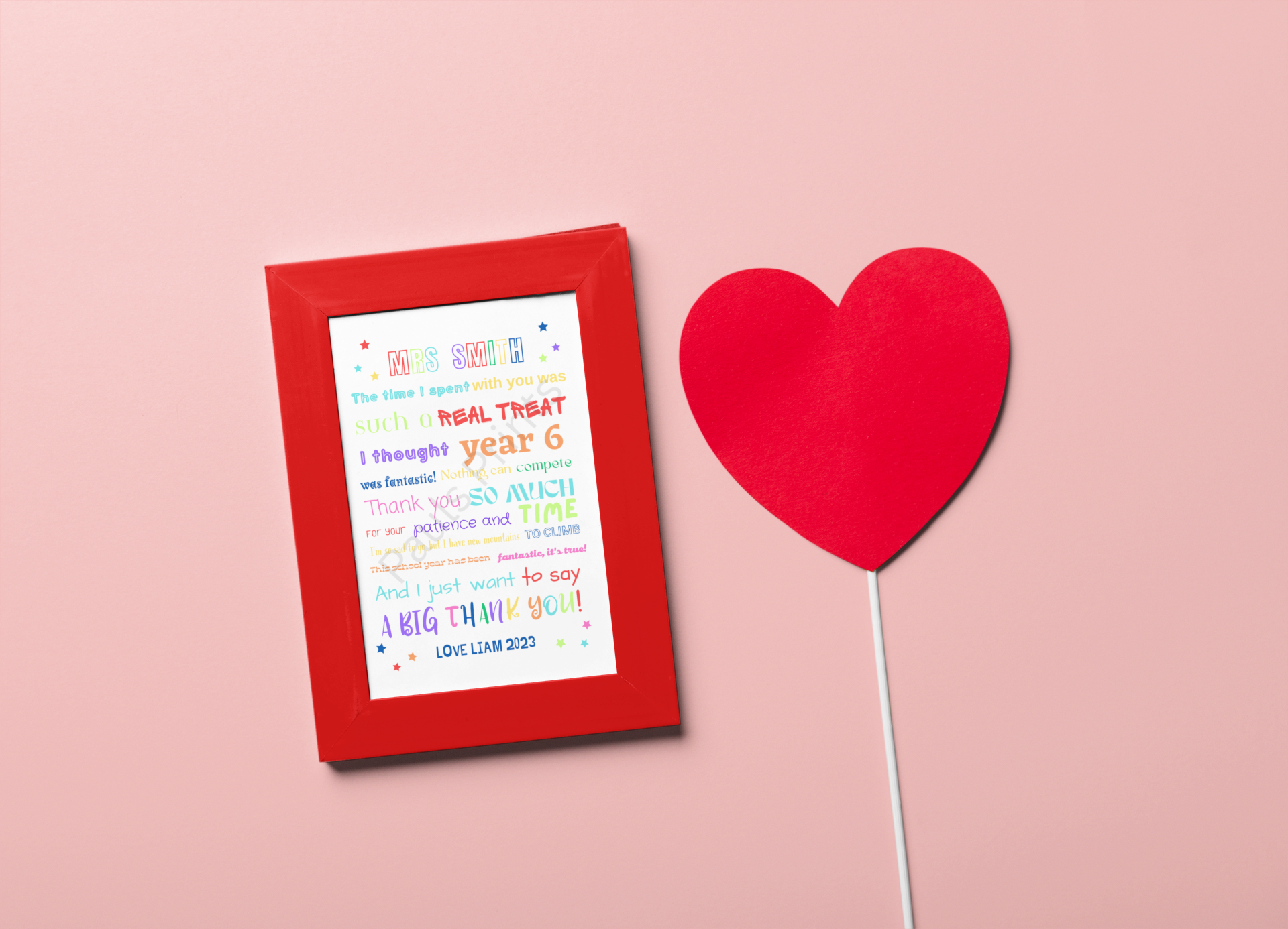 Colourful teacher thank you poem in a red frame placed on a pink background with red paper heart prop.