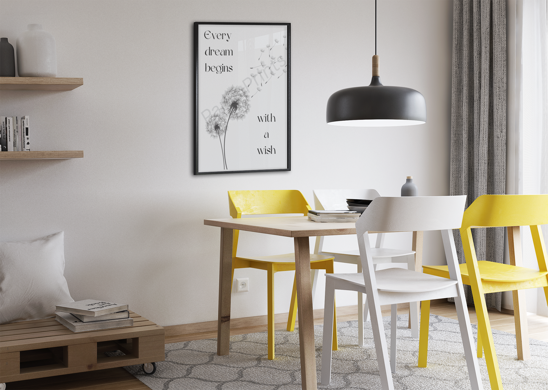 Dandelion quote print in a black frame, hanging on a neutral wall above a dining table with yellow and white chairs.