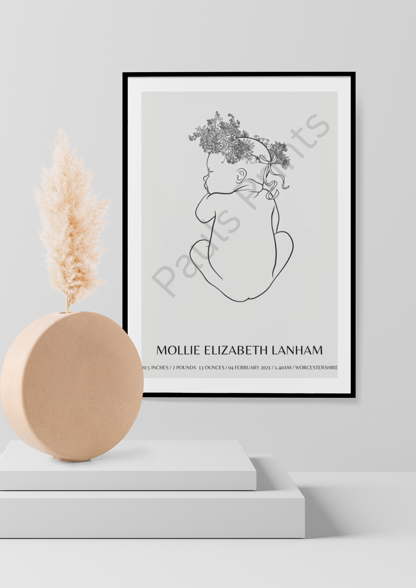 Minimalist custom baby print with botanical crown, styled in a grey room with pampas grass and geometric vase.