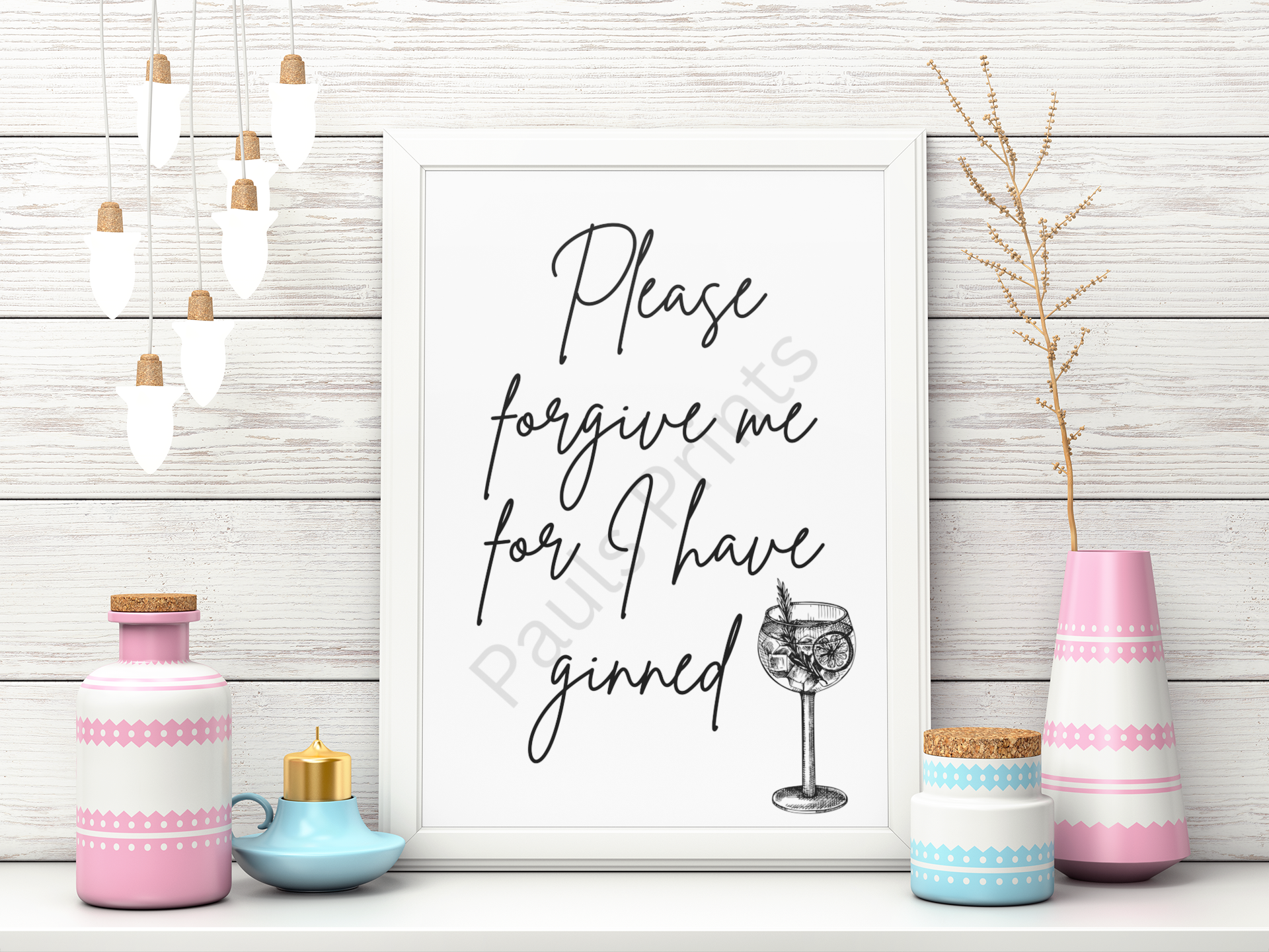 Humorous gin-themed framed print reading “Please forgive me for I have ginned” displayed with pastel vases on white wooden wall.