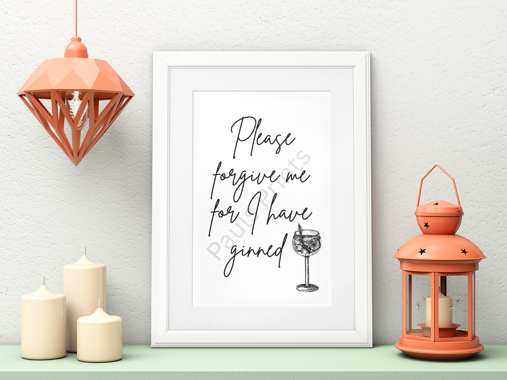 White-framed gin quote print surrounded by candles, coral lantern, and matching pendant light.
