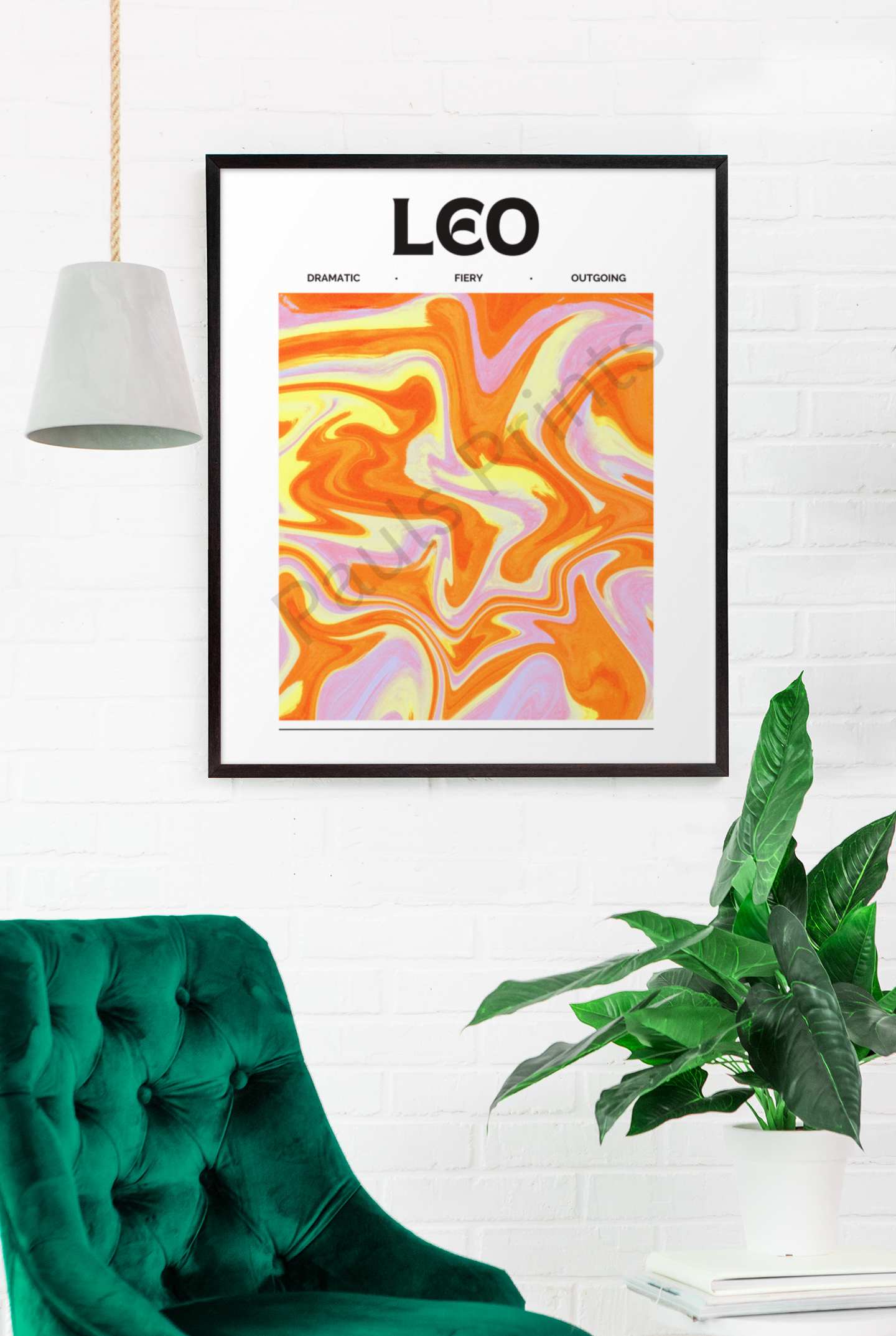 Vibrant Leo zodiac sign artwork with orange and yellow swirls, framed in black and mounted on a white brick wall above a velvet green chair and houseplant.
