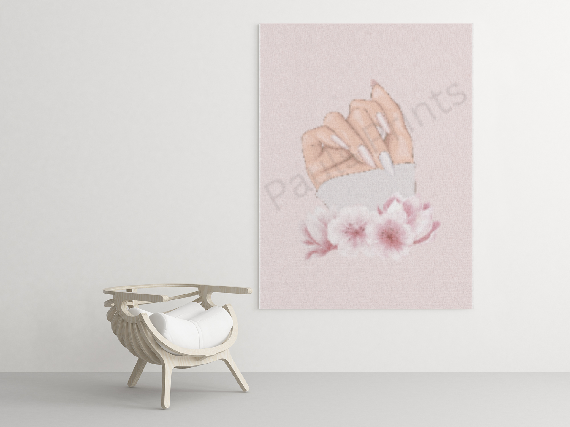 Large canvas print of a hand with long nails and pink blossoms, hanging above a designer chair in a minimalist room.
