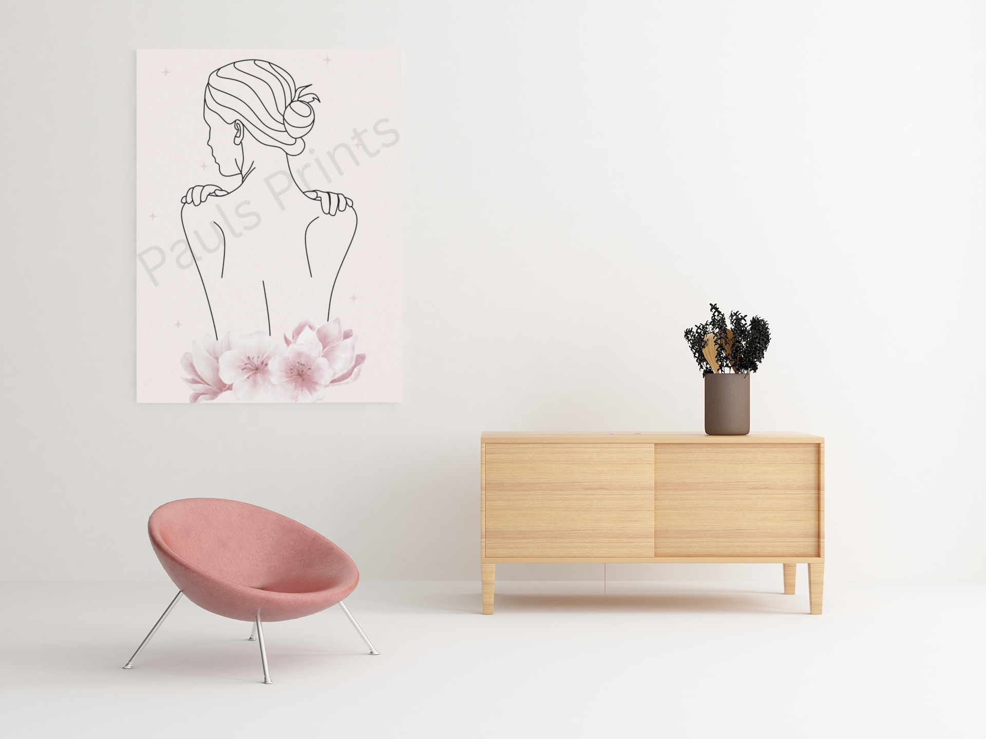 Large canvas print of a minimalist line art woman with pink flowers, displayed next to a pink chair and light wood cabinet in a bright, minimal living space.