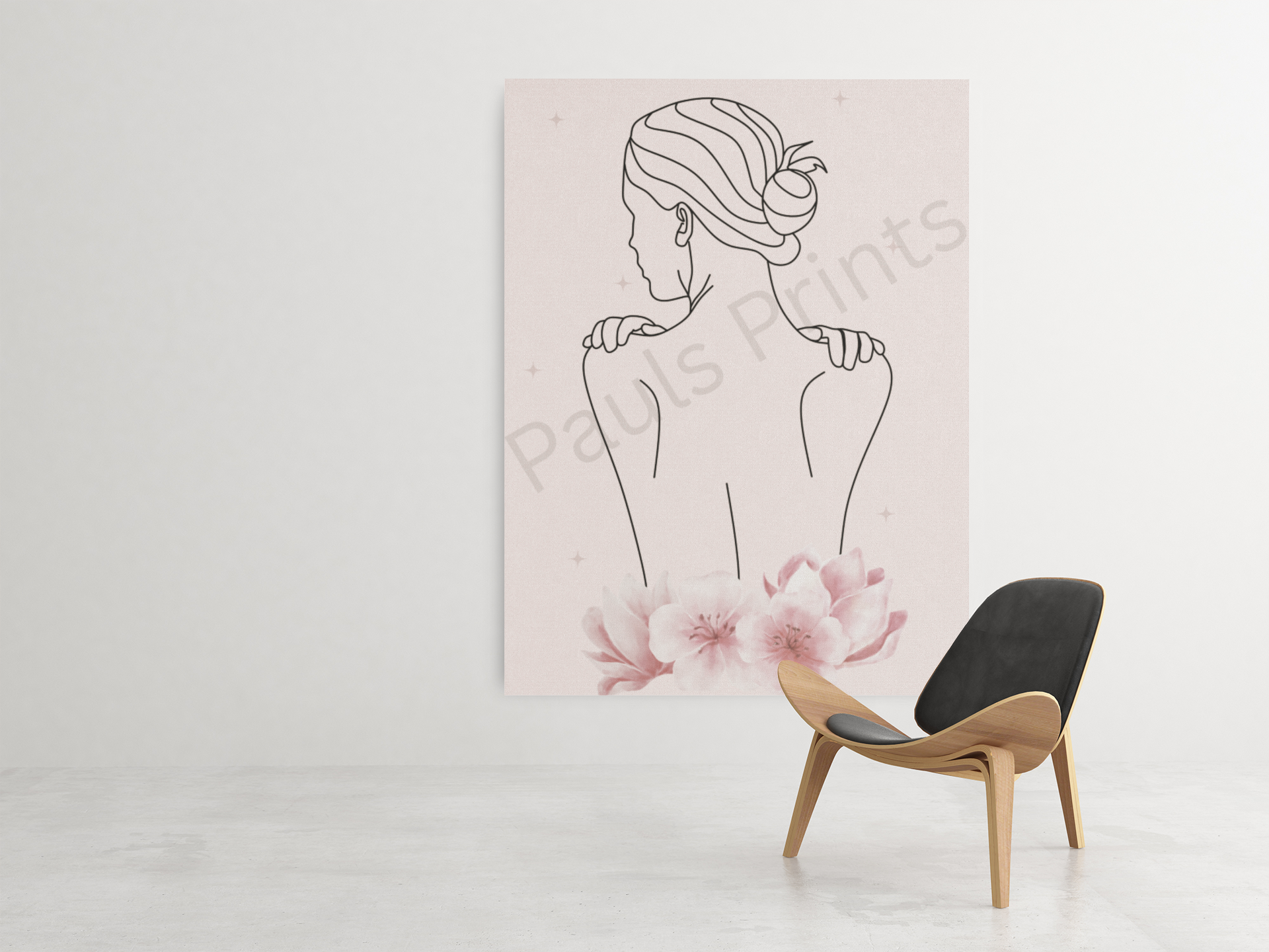Large minimalist line drawing of a woman’s back with a bun hairstyle, accented by soft pink flowers, displayed above a modern wood chair in a minimal white room.