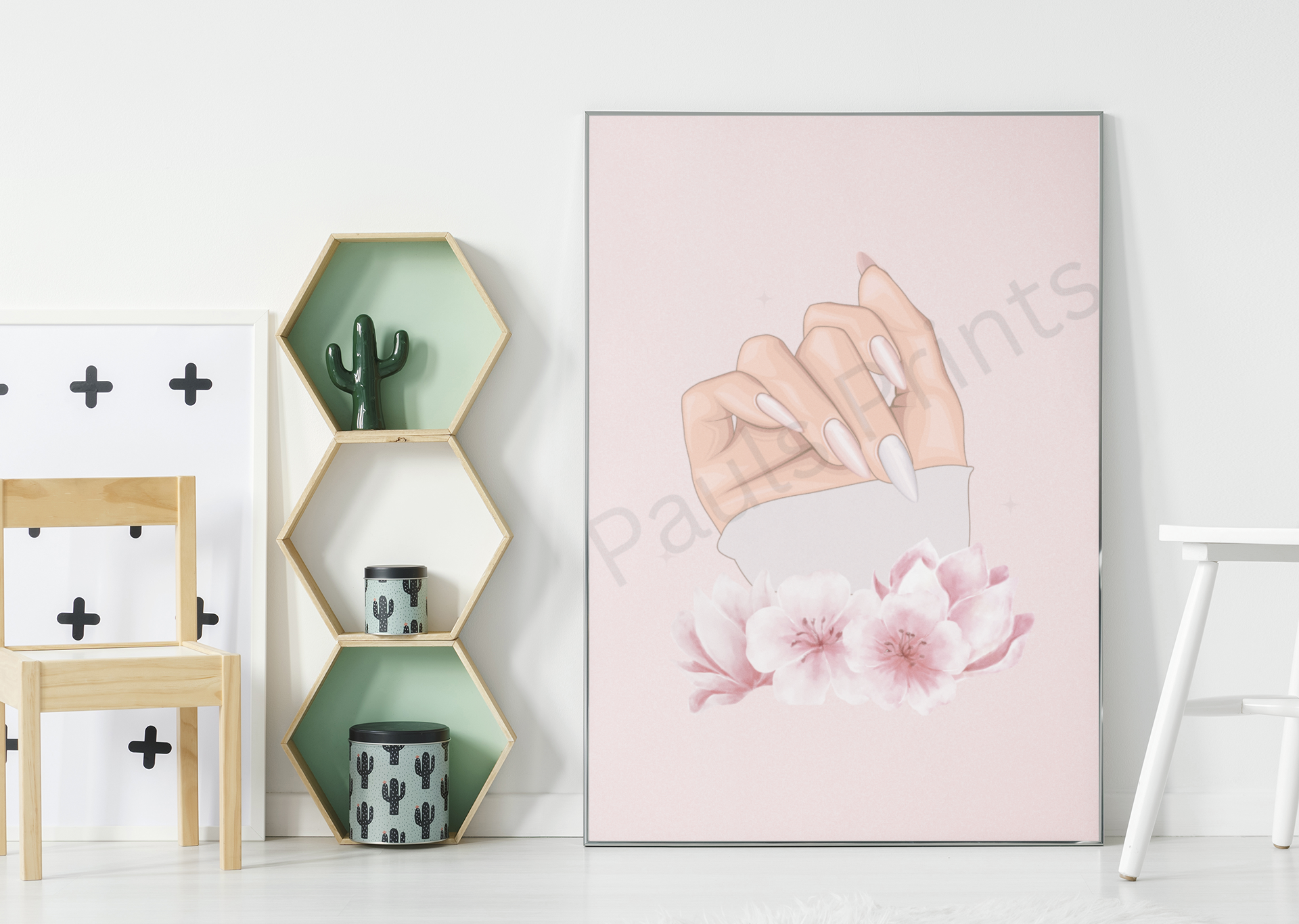 Large art print of a hand with manicured nails and blossoms leaning against a wall in a modern room.