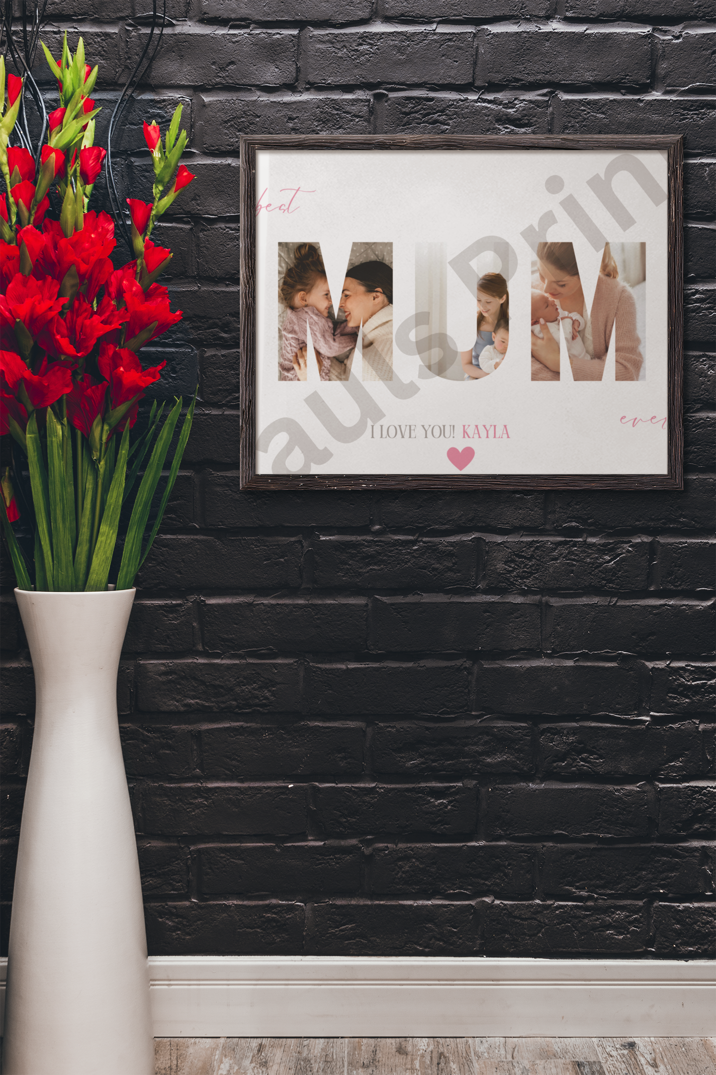 MUM collage wall art with personalised name "Kayla" and heart detail, displayed against a black brick wall beside a tall vase of red flowers.