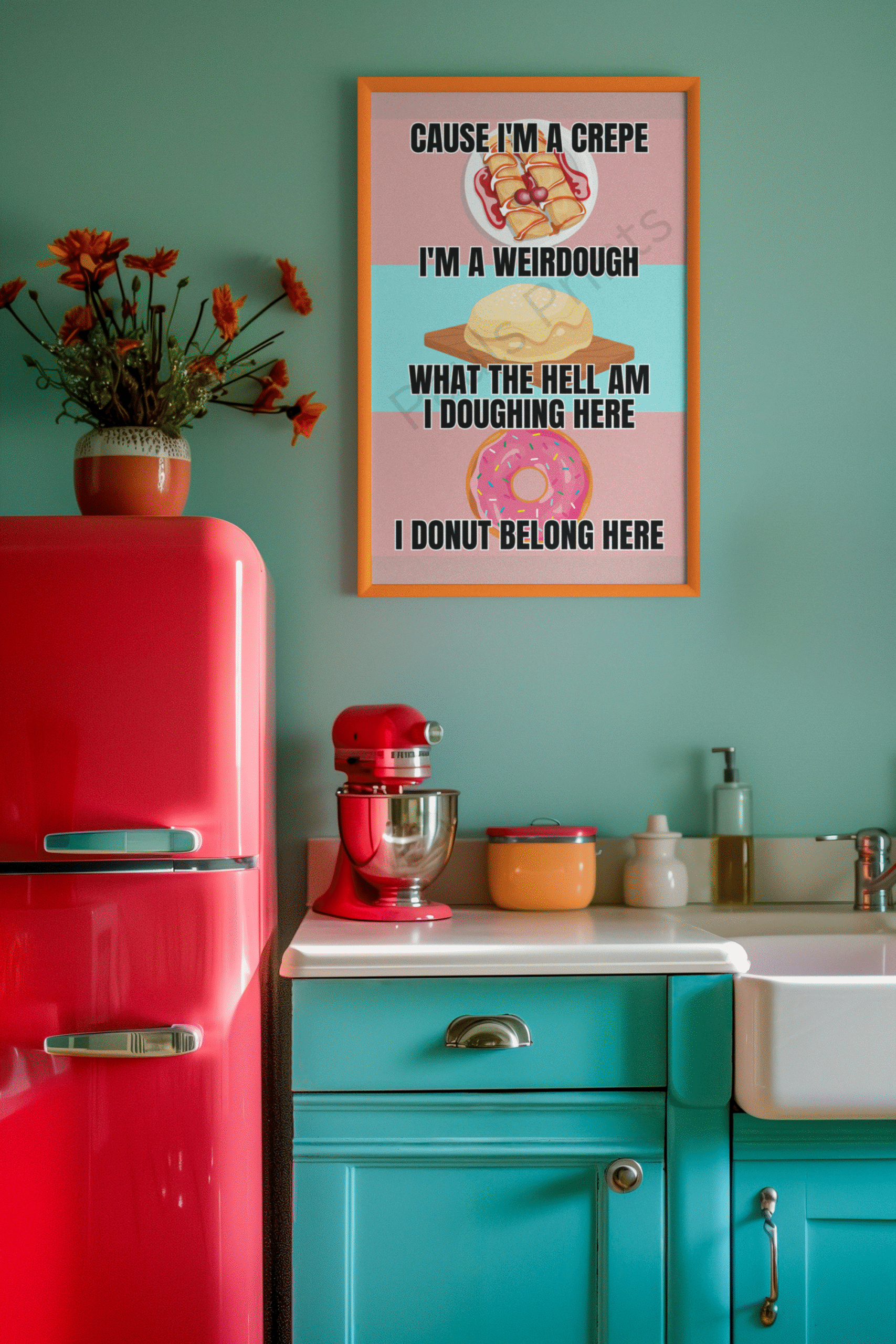 Bright and colorful retro kitchen wall art with playful baking puns and illustrations of a crepe, dough, and donut, framed in orange and hung above a turquoise and red kitchen setup.