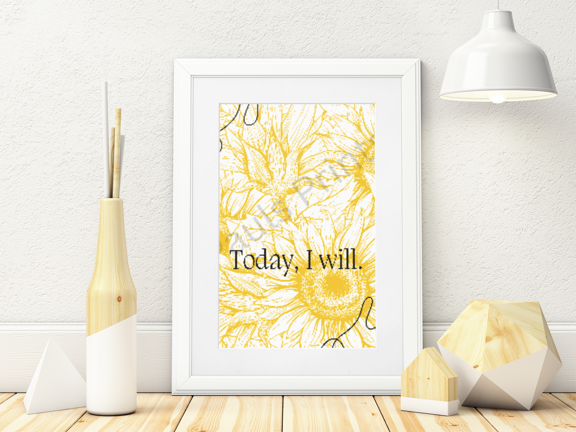 White-framed sunflower art print in yellow and white with “Today I will.” text, displayed on a light wooden floor next to geometric wooden decor.