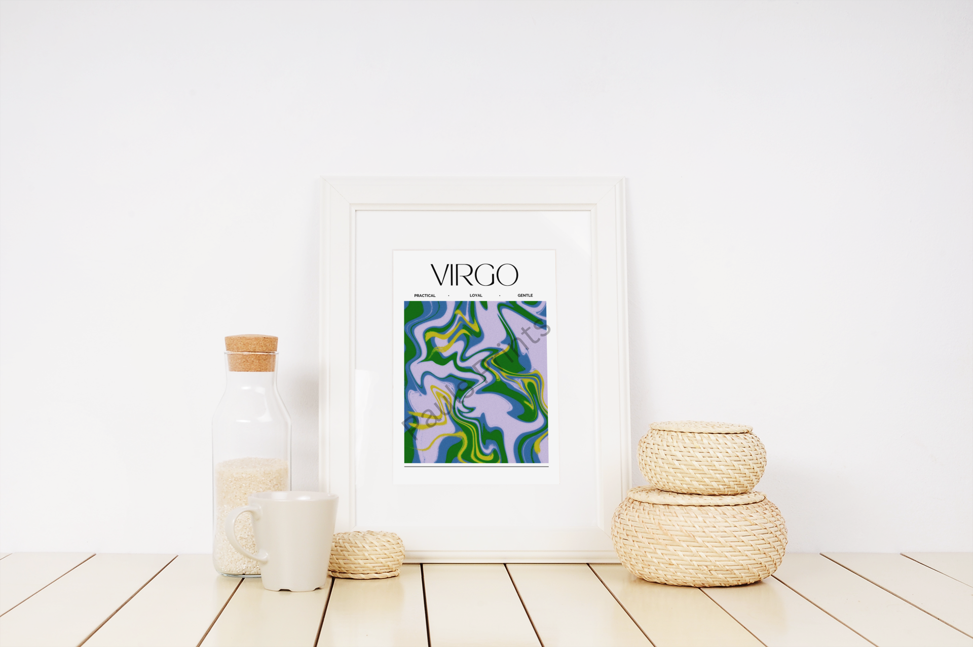 Virgo star sign artwork in pastel green and purple hues, framed in white and styled with natural elements like wicker baskets and a cork-topped glass bottle.