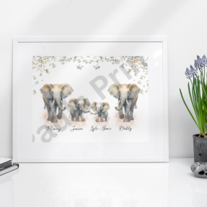 Personalised elephant family print framed in white and placed on a minimalist desk with purple flowers and a reed diffuser