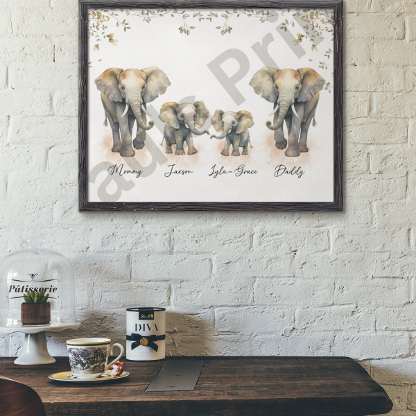 Framed elephant family print with names Mommy, Jaxson, Isla-Grace, and Daddy, styled on a white brick wall above a rustic wooden kitchen table